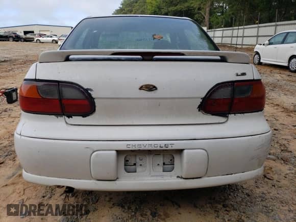 2000 Chevrolet Malibu LS z VIN 1G1NE52J5Y6350025, wystawiony jako Copart lot #73934584 z przebiegiem 103 781 mil mil oraz Szkoda całkowita • Salvage title. Historia ofert i sprzedaży dostępna na DreamBid. Obrazek 6.