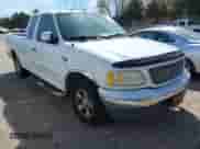 2003 Ford F-150 XL with VIN 1FTRX17W03NA37401, listed as a IAAI auction lot 41724466 with 350,336 mi miles and . Bid and sale history available at DreamBid. Image 1.