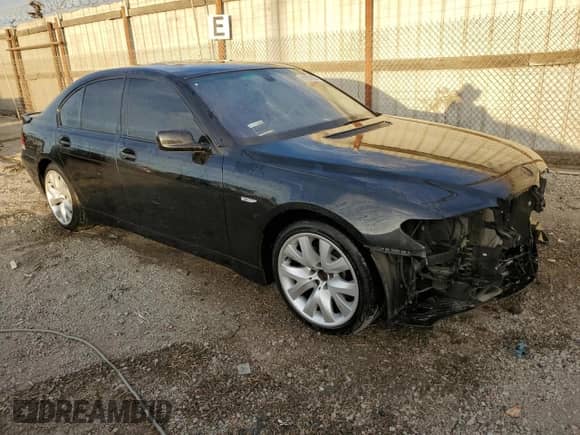 2003 BMW 7 Series 745i with VIN WBAGL63483DP65989, listed as a Copart auction lot 82057064 with 60,735 mi miles and Salvage title. Bid and sale history available at DreamBid. Image 4.