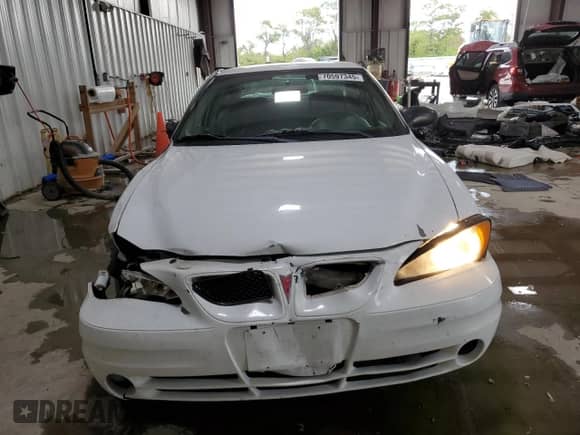 2004 Pontiac Grand Am SE1 with VIN 1G2NF52E84M669999, listed as a Copart auction lot 70597345 with 186,803 mi miles and Salvage title. Bid and sale history available at DreamBid. Image 5.