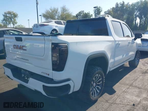 2023 GMC Sierra 1500 AT4 with VIN 1GTUUEE80PZ159009, listed as a IAAI auction lot 42804476 with 36,985 mi miles and . Bid and sale history available at DreamBid. Image 4.