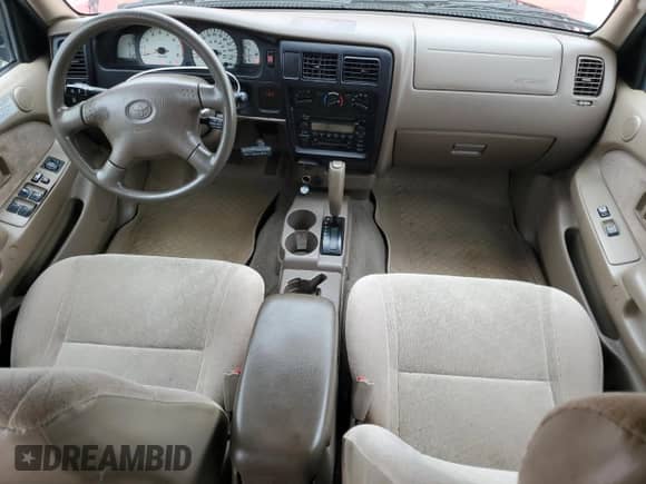 2002 Toyota Tacoma PreRunner z VIN 5TEGN92N42Z120044, wystawiony jako Copart lot #81899385 z przebiegiem 219 836 mil mil oraz Szkoda całkowita • Salvage title. Historia ofert i sprzedaży dostępna na DreamBid. Obrazek 8.