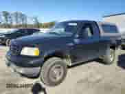2002 Ford F-150 XL z VIN 1FTRF18232NA58109, wystawiony jako Copart lot #79080674 z przebiegiem 148 213 mil mil oraz Szkoda całkowita • Salvage title. Historia ofert i sprzedaży dostępna na DreamBid. Obrazek 1.