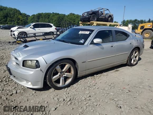 2007 Dodge Charger SRT-8 с VIN 2B3LA73W37H668188, выставлен на аукционе Copart как лот 68350674 с пробегом 150 769 миль миль и Списание • Salvage title. История ставок и продаж доступна на DreamBid. Изображение 1.