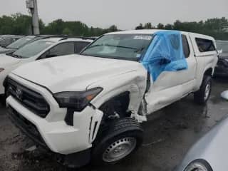 2024 Toyota Tacoma SR with VIN 3TYJDAHN1RT004586, listed as a Copart auction lot 58944565 with 14,886 mi miles and Salvage title. Bid and sale history available at DreamBid. Image 1.