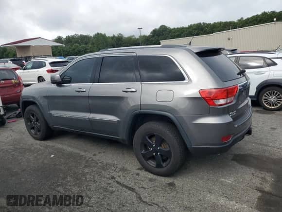 2012 Jeep Grand Cherokee Laredo with VIN 1C4RJFAG1CC293722, listed as a Copart auction lot 68848665 with 114,707 mi miles and Salvage title. Bid and sale history available at DreamBid. Image 2.