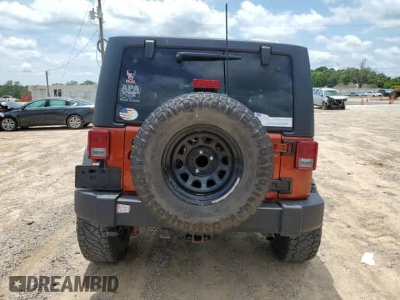 2014 Jeep Wrangler Rubicon with VIN 1C4BJWCG7EL221506, listed as a Copart auction lot 62457345 with 69,606 mi miles and Salvage title. Bid and sale history available at DreamBid. Image 6.