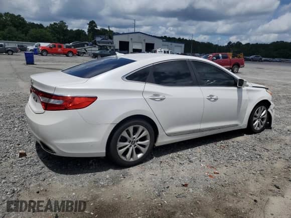 2014 Hyundai Azera с VIN KMHFG4JG3EA348610, выставлен на аукционе Copart как лот 61242735 с пробегом 190 846 миль миль и Списание • Salvage title. История ставок и продаж доступна на DreamBid. Изображение 3.