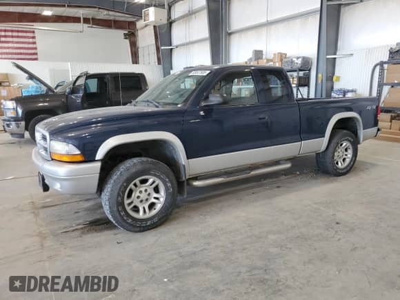 2003 Dodge Dakota SLT z VIN 1D7HG42N13S111122, wystawiony jako Copart lot #65447505 z przebiegiem 89 870 mil mil oraz Szkoda całkowita • Salvage title. Historia ofert i sprzedaży dostępna na DreamBid. Obrazek 1.