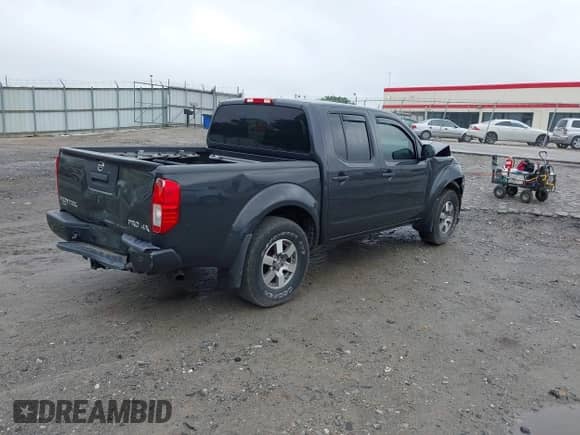 2013 Nissan Frontier SV with VIN 1N6AD0EV7DN761871, listed as a IAAI auction lot 42073290 with 150,412 mi miles and . Bid and sale history available at DreamBid. Image 4.