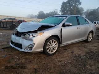 2012 Toyota Camry XLE with VIN 4T1BD1FK1CU049387, listed as a Copart auction lot 81140615 with 230,694 mi miles and Salvage title. Bid and sale history available at DreamBid. Image 1.