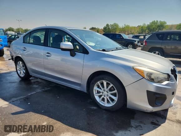 2013 Subaru Impreza Premium with VIN JF1GJAC60DH018559, listed as a Copart auction lot 70894195 with 137,226 mi miles and Salvage title. Bid and sale history available at DreamBid. Image 4.