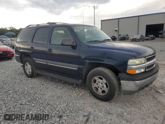 2004 Chevrolet Tahoe LT with VIN 1GNEC13Z04R122976, listed as a Copart auction lot 83970965 with 214,430 mi miles and Salvage title. Bid and sale history available at DreamBid. Image 4.