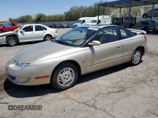 1999 Saturn SC with VIN 1G8ZY1277XZ299213, listed as a Copart auction lot 63788405 with 54,699 mi miles and Salvage title. Bid and sale history available at DreamBid. Image 1.