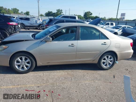 2005 Toyota Camry STD with VIN 4T1BE32KX5U084110, listed as a IAAI auction lot 43162822 with 210,556 mi miles and . Bid and sale history available at DreamBid. Image 13.