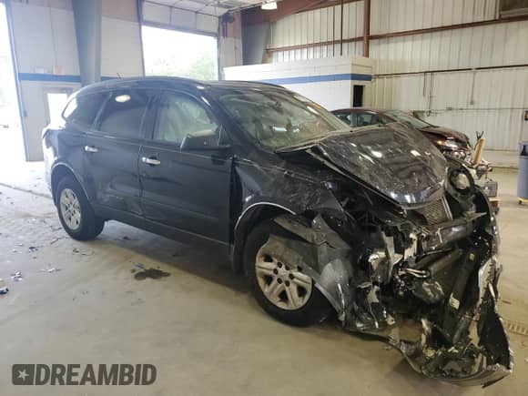 2016 Chevrolet Traverse LS z VIN 1GNKRFED8GJ185827, wystawiony jako Copart lot #85510055 z przebiegiem Nie podano mil oraz Szkoda całkowita • Salvage title. Historia ofert i sprzedaży dostępna na DreamBid. Obrazek 4.