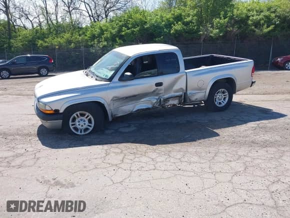 2001 Dodge Dakota with VIN 1B7GG22XX1S348751, listed as a IAAI auction lot 42077395 with 148,034 mi miles and . Bid and sale history available at DreamBid. Image 2.