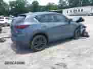 2024 Mazda CX-5 S Preferred z VIN JM3KFBCMXR0353819, wystawiony jako IAAI lot #42508482 z przebiegiem 13 458 mil mil oraz . Historia ofert i sprzedaży dostępna na DreamBid. Obrazek 4.