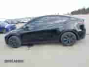 2024 Tesla Model Y with VIN 7SAYGDED8RF156984, listed as a IAAI auction lot 43324819 with 26,941 mi miles and . Bid and sale history available at DreamBid. Image 14.