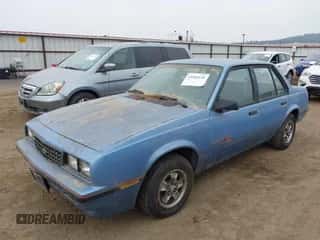 1987 Chevrolet Cavalier z VIN 1G1JE5115H7143418, wystawiony jako IAAI lot #43294141 z przebiegiem Nie podano mil oraz . Historia ofert i sprzedaży dostępna na DreamBid. Obrazek 2.