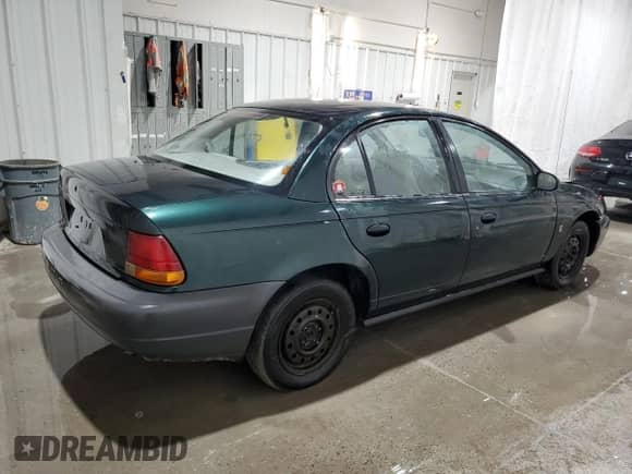 1998 Saturn SL с VIN 1G8ZH5280WZ312544, выставлен на аукционе Copart как лот 50971665 с пробегом 119 855 миль миль и Списание • Salvage title. История ставок и продаж доступна на DreamBid. Изображение 3.