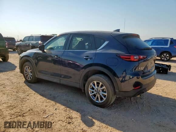 2023 Mazda CX-5 S Select with VIN JM3KFBBM0P0285688, listed as a Copart auction lot 67590615 with 28,029 mi miles and Salvage title. Bid and sale history available at DreamBid. Image 2.