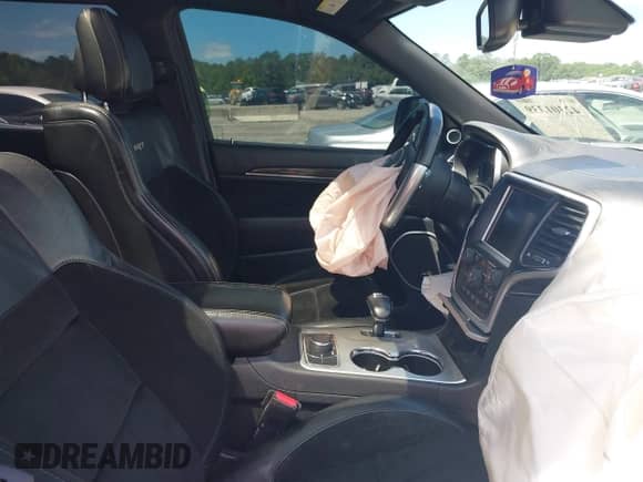 2014 Jeep Grand Cherokee SRT-8 z VIN 1C4RJFDJ2EC131267, wystawiony jako IAAI lot #42301339 z przebiegiem 174 980 mil mil oraz . Historia ofert i sprzedaży dostępna na DreamBid. Obrazek 5.