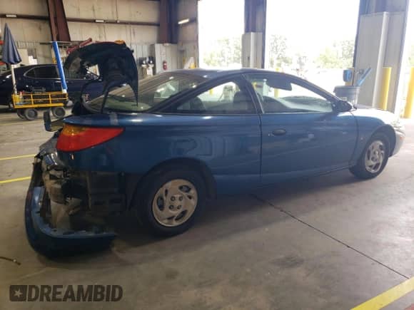 2001 Saturn SC с VIN 1G8ZP12861Z106908, выставлен на аукционе Copart как лот 69387405 с пробегом Не указан миль и Списание • Salvage title. История ставок и продаж доступна на DreamBid. Изображение 3.