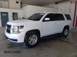 2018 Chevrolet Tahoe Commercial with VIN 1GNSKFEC1JR136893, listed as a Copart auction lot 84184285 with 151,847 mi miles and Clean title. Bid and sale history available at DreamBid. Image 1.