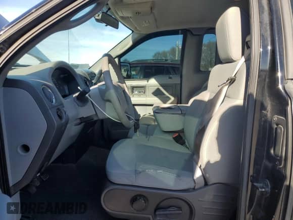 2007 Ford F-150 XL with VIN 1FTRF14V27KB48974, listed as a Copart auction lot 46954675 with 165,212 mi miles and Salvage title. Bid and sale history available at DreamBid. Image 7.