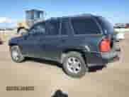 2005 Chevrolet TrailBlazer LS with VIN 1GNDT13S652152265, listed as a Copart auction lot 86664165 with 285,348 mi miles and Salvage title. Bid and sale history available at DreamBid. Image 2.