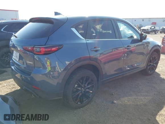 2025 Mazda CX-5 S Carbon Edition z VIN JM3KFBCM9S0588220, wystawiony jako IAAI lot #43244830 z przebiegiem 25 221 mil mil oraz . Historia ofert i sprzedaży dostępna na DreamBid. Obrazek 4.