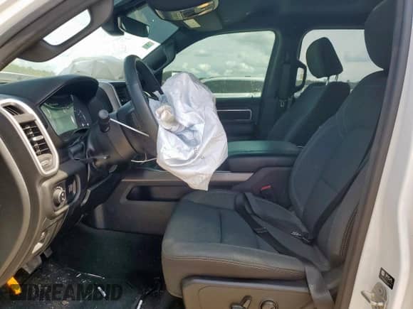 2023 Ram 1500 Lone Star with VIN 1C6SRFFT1PN692860, listed as a Copart auction lot 67404305 with 57,407 mi miles and Salvage title. Bid and sale history available at DreamBid. Image 7.