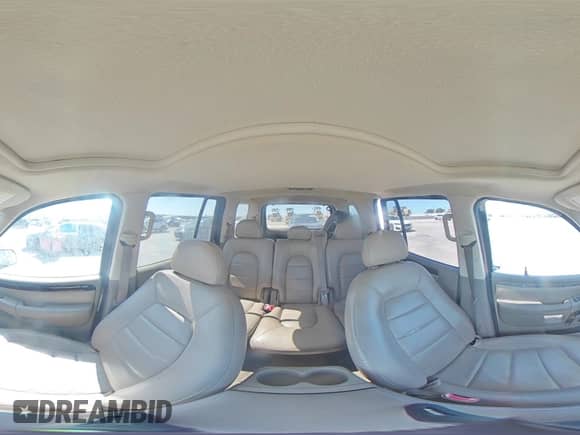2004 Ford Explorer with VIN 1FMZU65KX4UC05800, listed as a Copart auction lot 58423175 with 129,344 mi miles and Salvage title. Bid and sale history available at DreamBid. Image 16.
