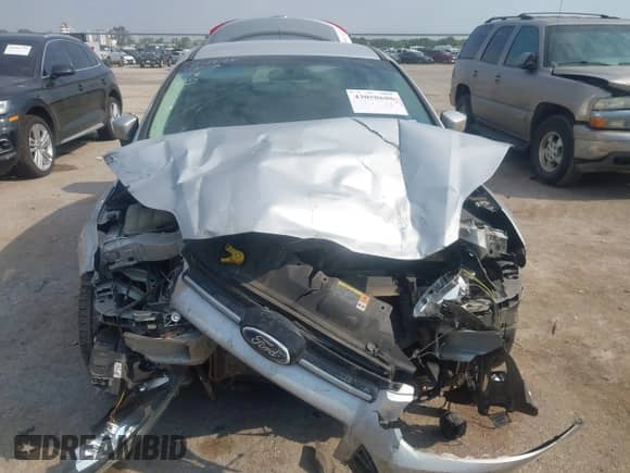 2013 Ford Focus Titanium z VIN 1FADP3J2XDL301612, wystawiony jako IAAI lot #43058686 z przebiegiem 92 471 mil mil oraz . Historia ofert i sprzedaży dostępna na DreamBid. Obrazek 12.