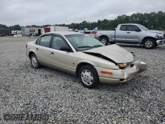2000 Saturn SL with VIN 1G8ZH5283YZ221335, listed as a Copart auction lot 84196955 with 157,098 mi miles and Salvage title. Bid and sale history available at DreamBid. Image 4.