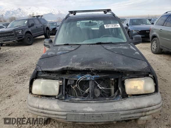 2000 Chevrolet Tracker with VIN 2CNBJ13C8Y6955130, listed as a Copart auction lot 89112385 with 289,680 mi miles and Salvage title. Bid and sale history available at DreamBid. Image 5.