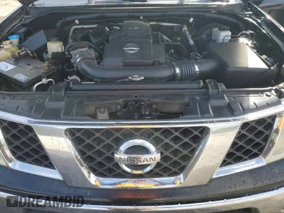 2005 Nissan Frontier SE z VIN 1N6AD06U75C448435, wystawiony jako Copart lot #85896125 z przebiegiem 193 360 mil mil oraz Szkoda całkowita • Salvage title. Historia ofert i sprzedaży dostępna na DreamBid. Obrazek 11.