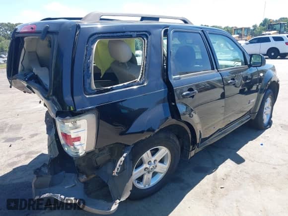 2009 Mercury Mariner Hybrid with VIN 4M2CU29359KJ17577, listed as a IAAI auction lot 43091811 with 247,830 mi miles and . Bid and sale history available at DreamBid. Image 4.