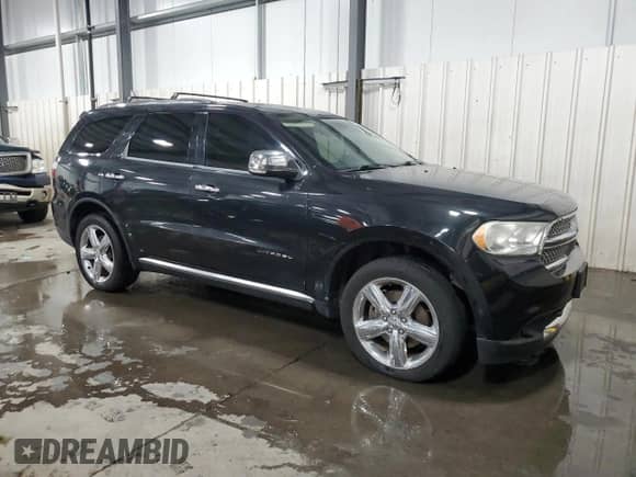 2012 Dodge Durango Citadel with VIN 1C4SDJET7CC301941, listed as a Copart auction lot 68397715 with 157,235 mi miles and Salvage title. Bid and sale history available at DreamBid. Image 4.