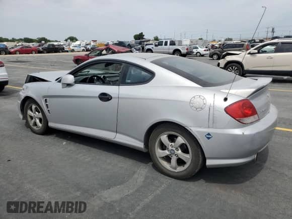 2006 Hyundai Tiburon GS с VIN KMHHM65D86U212227, выставлен на аукционе Copart как лот 59633855 с пробегом Не указан миль и Списание • Salvage title. История ставок и продаж доступна на DreamBid. Изображение 2.