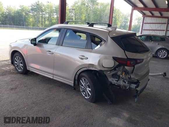 2025 Mazda CX-5 S Select z VIN JM3KFBBLXS0628958, wystawiony jako IAAI lot #42463967 z przebiegiem 1 924 mil mil oraz . Historia ofert i sprzedaży dostępna na DreamBid. Obrazek 3.