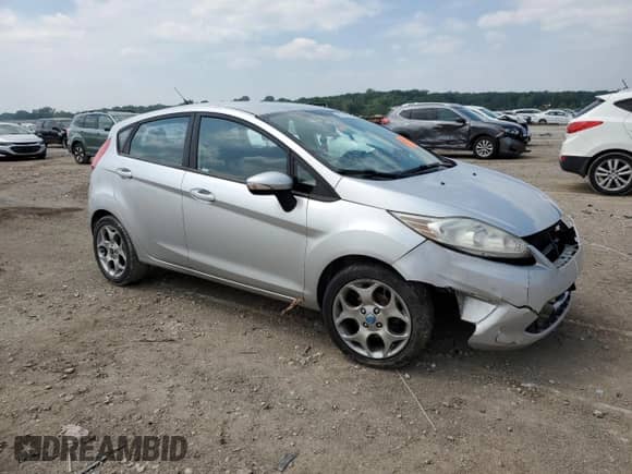 2012 Ford Fiesta SES with VIN 3FADP4FJ3CM173961, listed as a Copart auction lot 59742935 with Not provided miles and Salvage title. Bid and sale history available at DreamBid. Image 4.