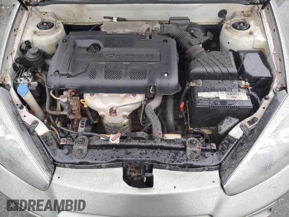 2008 Hyundai Tiburon GS с VIN KMHHM66D18U264820, выставлен на аукционе Copart как лот 54485415 с пробегом 158 129 миль миль и Списание • Salvage title. История ставок и продаж доступна на DreamBid. Изображение 11.