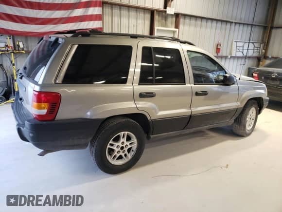 1999 Jeep Grand Cherokee Laredo с VIN 1J4G258S1XC668517, выставлен на аукционе Copart как лот 79958454 с пробегом Не указан миль и Списание • Salvage title. История ставок и продаж доступна на DreamBid. Изображение 3.