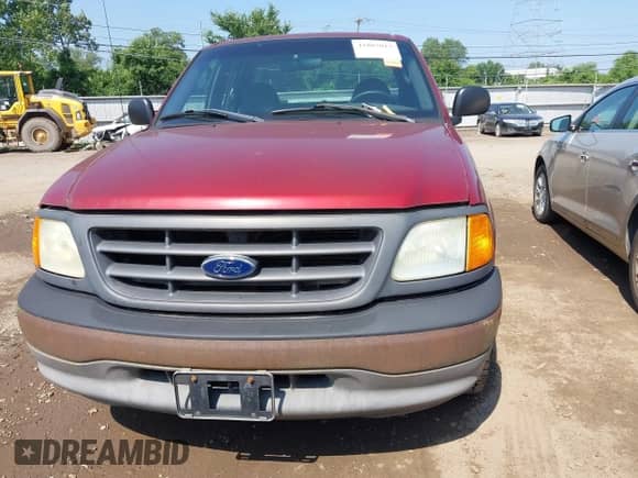 2004 Ford F-150 XL with VIN 2FTRX17204CA57555, listed as a IAAI auction lot 42807013 with Not provided miles and . Bid and sale history available at DreamBid. Image 6.
