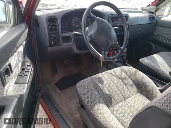 1996 Nissan Frontier XE with VIN 1N6SD16S8TC335129, listed as a Copart auction lot 55884495 with 313,757 mi miles and Salvage title. Bid and sale history available at DreamBid. Image 8.