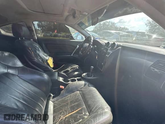 2005 Hyundai Tiburon GT с VIN KMHHN65F85U183258, выставлен на аукционе Copart как лот 77880944 с пробегом 281 902 миль миль и Чистый • Clean title. История ставок и продаж доступна на DreamBid. Изображение 5.