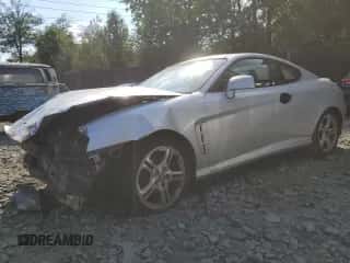 2006 Hyundai Tiburon GT с VIN KMHHN65F76U229244, выставлен на аукционе Copart как лот 71157904 с пробегом 228 575 миль миль и Списание • Salvage title. История ставок и продаж доступна на DreamBid. Изображение 1.