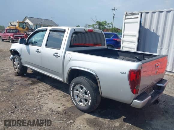 2011 Chevrolet Colorado 1LT z VIN 1GCHTCFEXB8131732, wystawiony jako IAAI lot #42595193 z przebiegiem 129 689 mil mil oraz . Historia ofert i sprzedaży dostępna na DreamBid. Obrazek 3.